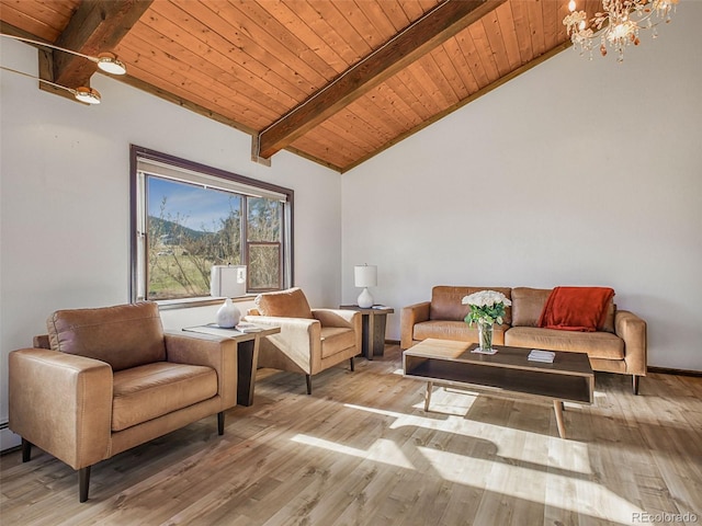 8473 Gray Fox Dr, Evergreen, CO 80439 - living area featuring vaulted ceiling with beams, light wood-style flooring, wood ceiling, and a chandelier