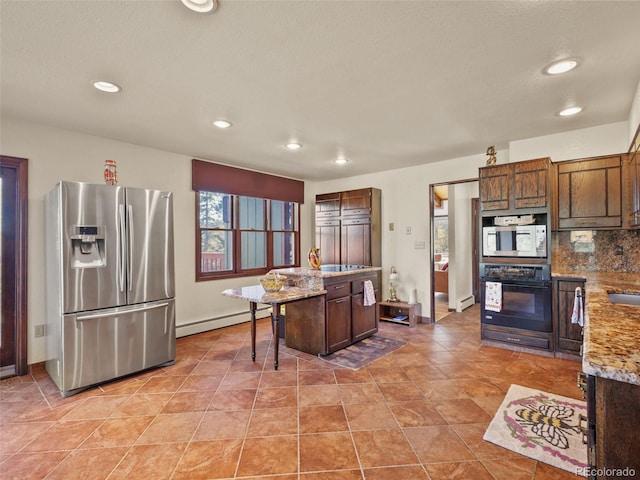 8473 Gray Fox Dr, Evergreen, CO 80439 - kitchen featuring stainless steel refrigerator with ice dispenser, built in microwave, a baseboard heating unit, black oven, and recessed lighting