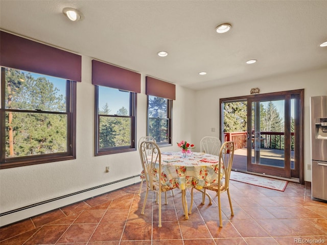 8473 Gray Fox Dr, Evergreen, CO 80439 - tiled dining area with a baseboard heating unit and recessed lighting
