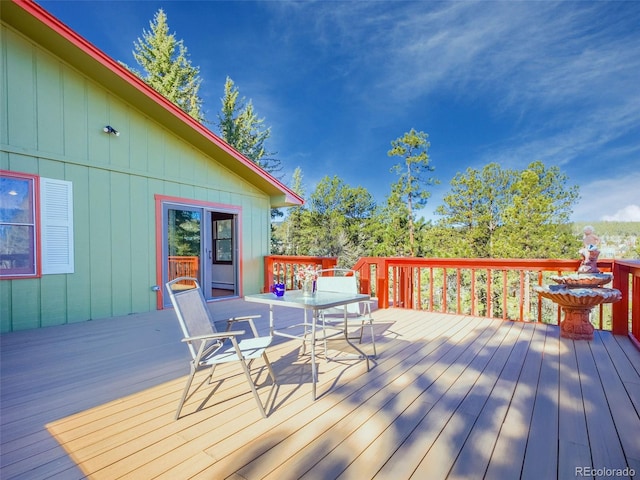 8473 Gray Fox Dr, Evergreen, CO 80439 - wooden deck with outdoor dining space