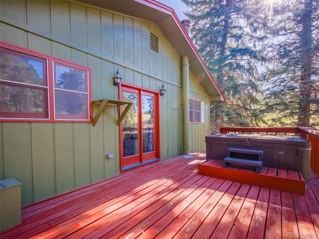 8473 Gray Fox Dr, Evergreen, CO 80439 - wooden terrace featuring visible vents and a hot tub