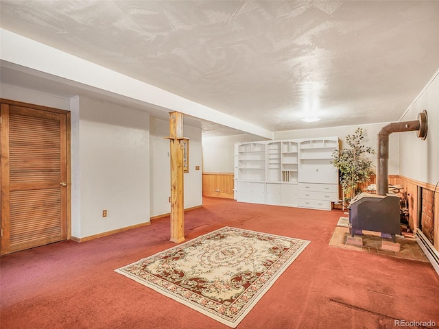 8473 Gray Fox Dr, Evergreen, CO 80439 - finished basement with a wood stove and carpet flooring