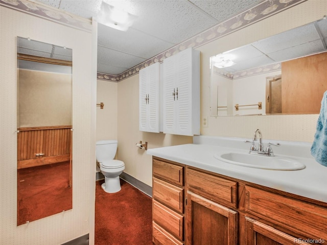 8473 Gray Fox Dr, Evergreen, CO 80439 - bathroom with vanity, a drop ceiling, and toilet
