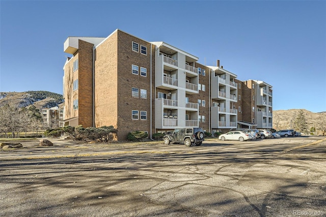 view of building exterior featuring a mountain view