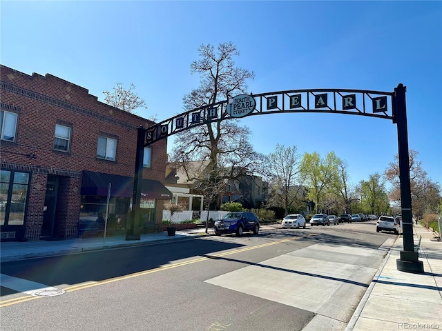 view of street with sidewalks and curbs