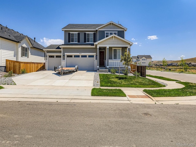 9054 Truckee Ct, Commerce City, CO 80022 - view of front facade featuring driveway, an attached garage, covered porch, and a shingled roof