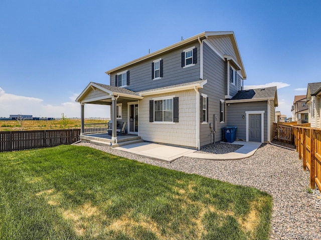 9054 Truckee Ct, Commerce City, CO 80022 - rear view of house with a fenced backyard and a patio