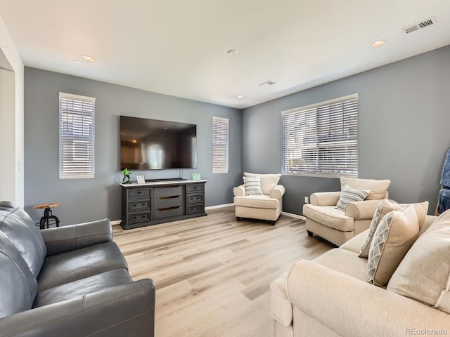 9054 Truckee Ct, Commerce City, CO 80022 - living room featuring light wood-type flooring, plenty of natural light, and recessed lighting