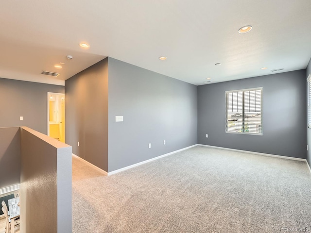 9054 Truckee Ct, Commerce City, CO 80022 - spare room featuring light colored carpet, recessed lighting, and a smoke detector