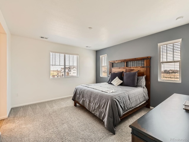 9054 Truckee Ct, Commerce City, CO 80022 - carpeted bedroom featuring multiple windows