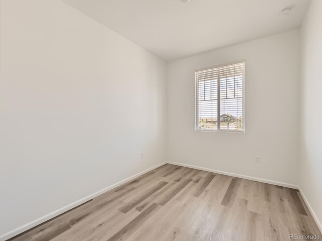 9054 Truckee Ct, Commerce City, CO 80022 - empty room featuring light wood finished floors and a smoke detector