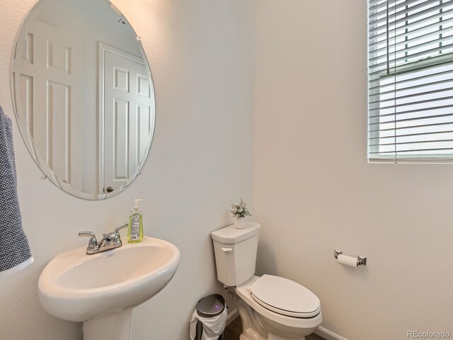 9054 Truckee Ct, Commerce City, CO 80022 - half bath featuring a sink and toilet