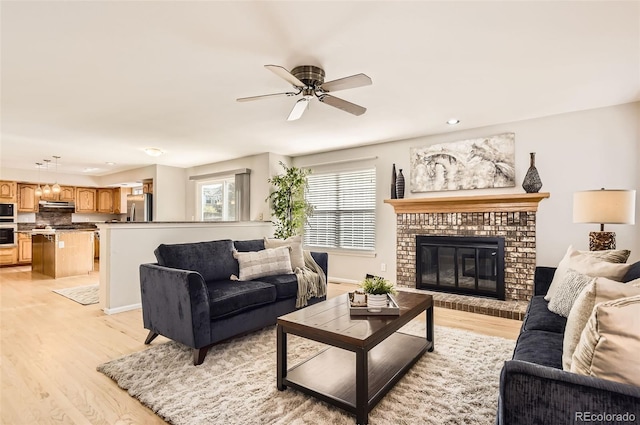 1516 Saltbush Ridge Rd, Highlands Ranch, CO 80126 - living room featuring ceiling fan, recessed lighting, light wood-style floors, and a fireplace