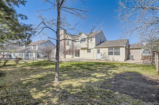 1516 Saltbush Ridge Rd, Highlands Ranch, CO 80126 - rear view of property featuring a residential view, fence, a patio, and a lawn