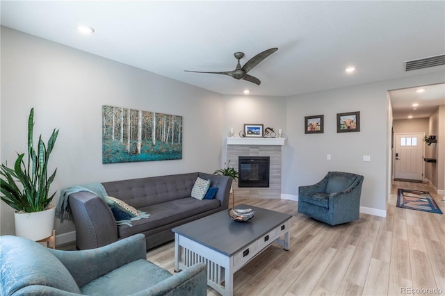 9843 Rosalee Peak St, Littleton, CO 80125 - living area featuring light wood-style flooring, ceiling fan, recessed lighting, a fireplace, and baseboards