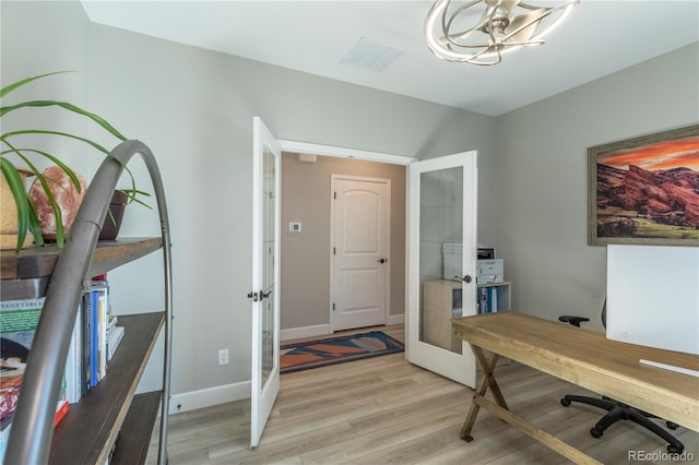 9843 Rosalee Peak St, Littleton, CO 80125 - office featuring french doors, light wood finished floors, a chandelier, and baseboards