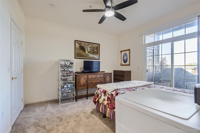 bedroom with light colored carpet and ceiling fan