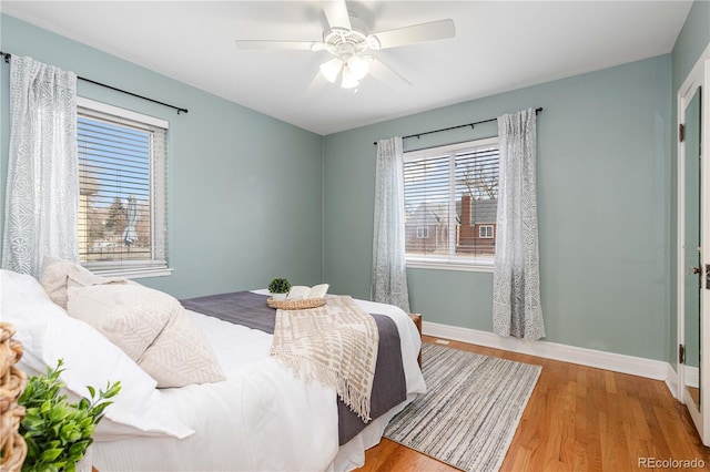 bedroom featuring ceiling fan and light hardwood / wood-style flooring