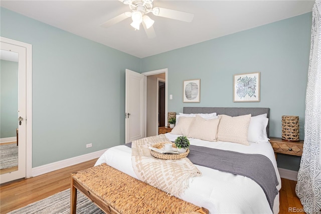 bedroom featuring ceiling fan and hardwood / wood-style floors