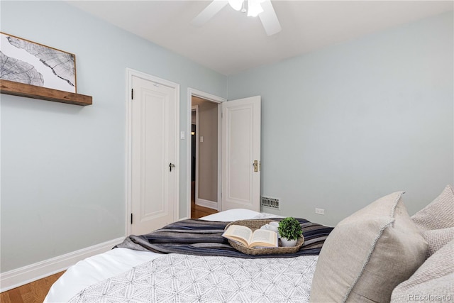 bedroom featuring ceiling fan and hardwood / wood-style floors