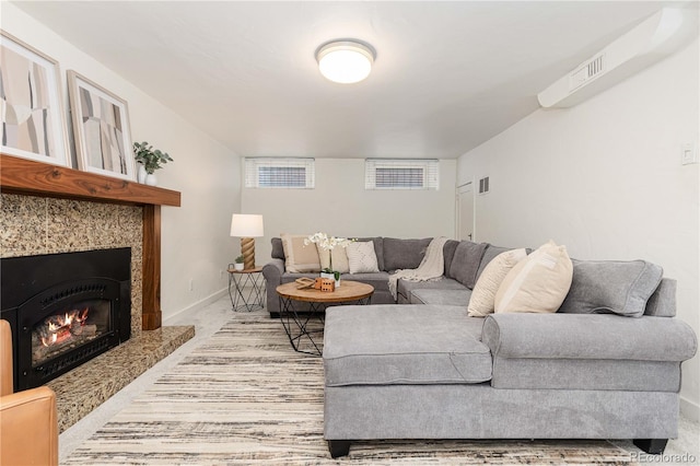 living room with light colored carpet and a fireplace