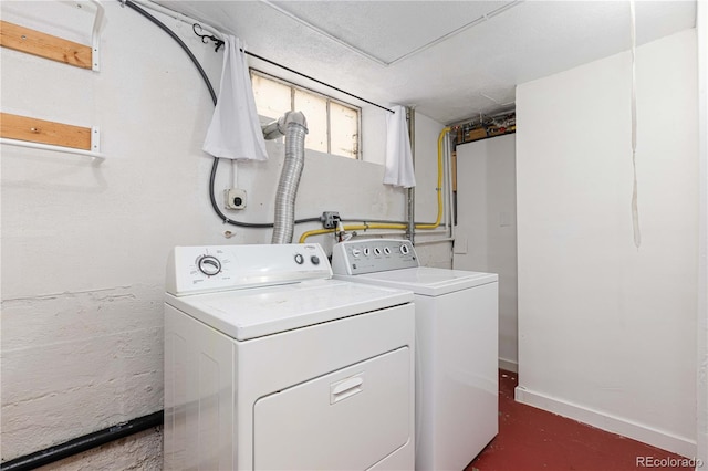 clothes washing area featuring washing machine and dryer