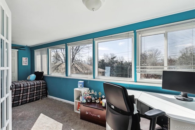 carpeted office featuring baseboards