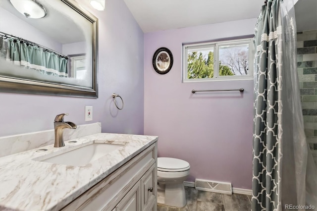 full bathroom featuring toilet, wood finish floors, vanity, visible vents, and baseboards