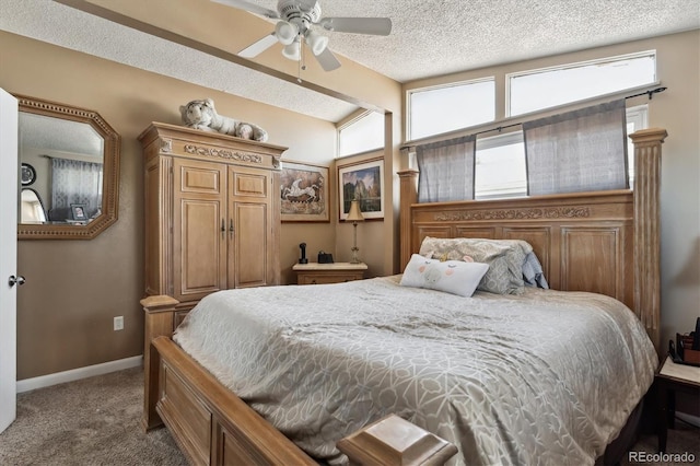 carpeted bedroom featuring lofted ceiling, a ceiling fan, baseboards, and a textured ceiling