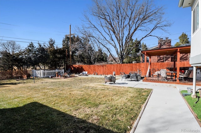 view of yard with a patio area and a fenced backyard