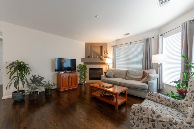 8338 S Independence Cir Unit 108, Littleton, CO 80128 - living room featuring wood finished floors, healthy amount of natural light, and a tile fireplace