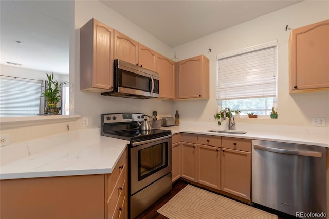 8338 S Independence Cir Unit 108, Littleton, CO 80128 - kitchen featuring appliances with stainless steel finishes and light stone counters