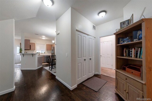 8338 S Independence Cir Unit 108, Littleton, CO 80128 - corridor featuring dark wood finished floors and baseboards