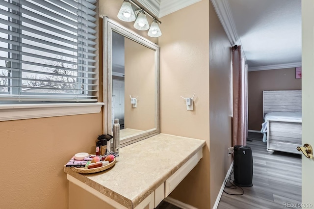 bathroom with hardwood / wood-style flooring and crown molding