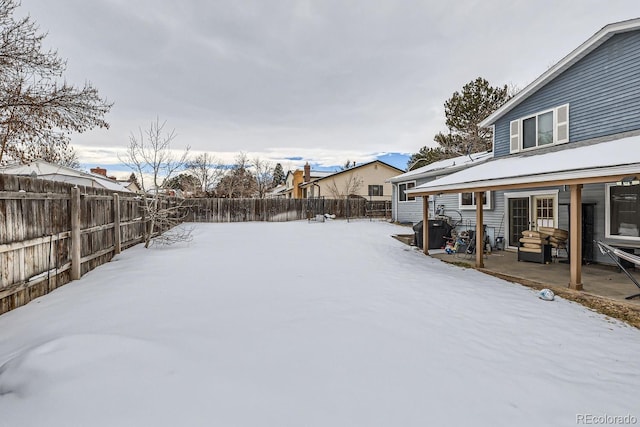 view of yard layered in snow