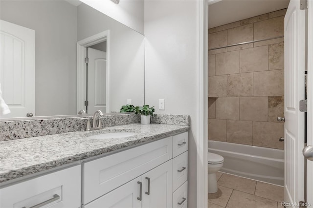 bathroom with vanity, tile patterned floors, toilet, and shower / bath combination