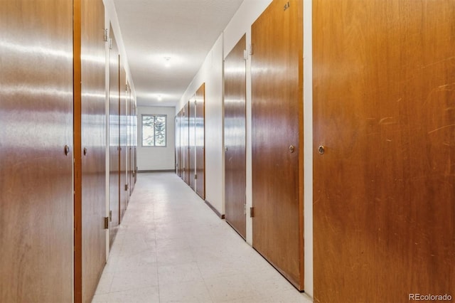 690 S Alton Way Unit 1C, Denver, CO 80247 - hallway with light flooring