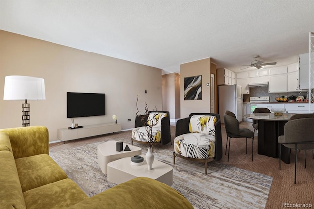 690 S Alton Way Unit 1C, Denver, CO 80247 - carpeted living area with a ceiling fan