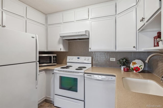 690 S Alton Way Unit 1C, Denver, CO 80247 - kitchen featuring white appliances, under cabinet range hood, a sink, white cabinets, and light countertops