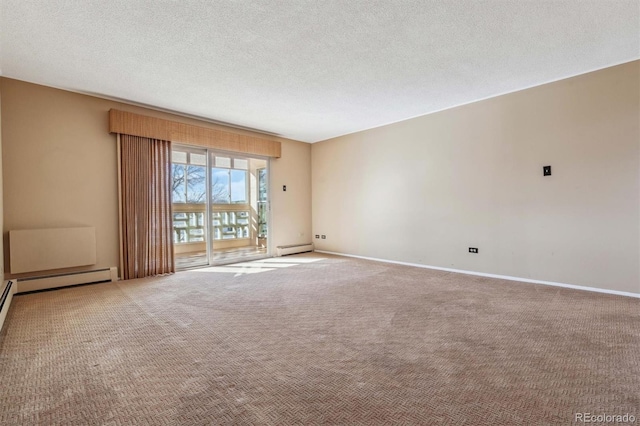 690 S Alton Way Unit 1C, Denver, CO 80247 - carpeted empty room with baseboard heating, a textured ceiling, and baseboards