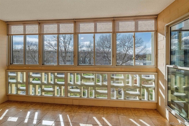 unfurnished sunroom featuring a healthy amount of sunlight