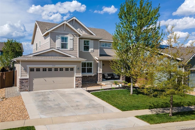 15389 W 50th Dr, Golden, CO 80403 - craftsman inspired home with board and batten siding, an attached garage, stone siding, concrete driveway, and a shingled roof
