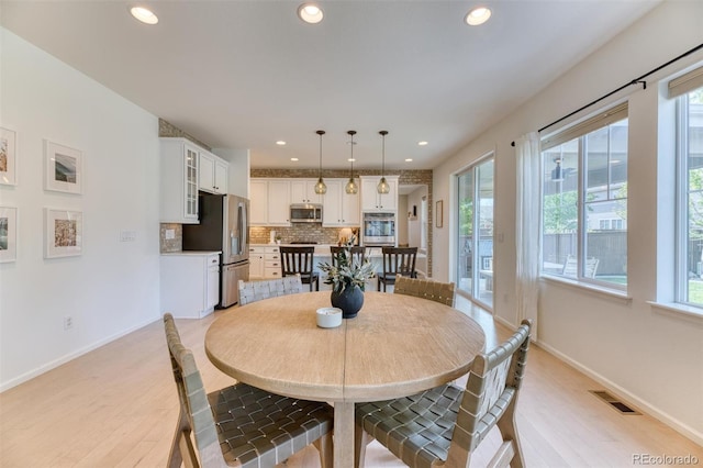 15389 W 50th Dr, Golden, CO 80403 - dining area featuring light wood finished floors, recessed lighting, and baseboards
