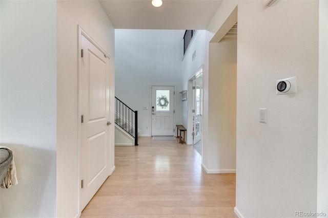15389 W 50th Dr, Golden, CO 80403 - foyer entrance with light wood-style flooring, stairs, and baseboards
