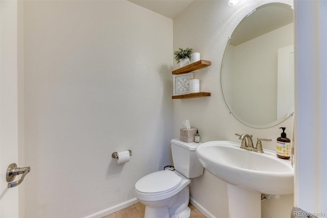 15389 W 50th Dr, Golden, CO 80403 - bathroom with baseboards, toilet, tile patterned floors, and a sink