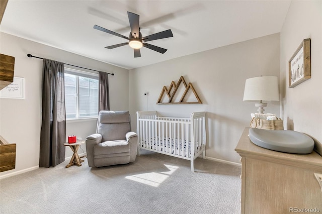 15389 W 50th Dr, Golden, CO 80403 - bedroom featuring carpet, a nursery area, baseboards, and ceiling fan