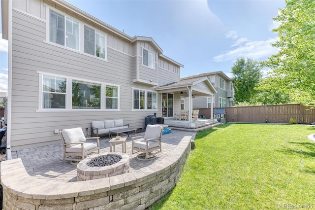 15389 W 50th Dr, Golden, CO 80403 - rear view of house with a patio, an outdoor living space with a fire pit, and a ceiling fan