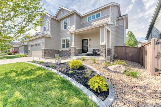 15389 W 50th Dr, Golden, CO 80403 - craftsman-style home featuring board and batten siding, stone siding, covered porch, and driveway