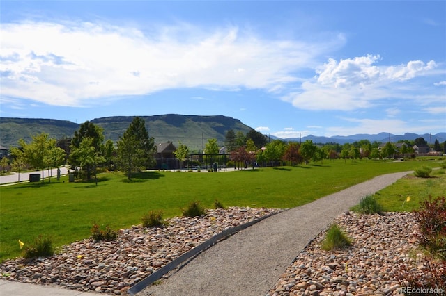 15389 W 50th Dr, Golden, CO 80403 - surrounding community featuring a mountain view and a lawn