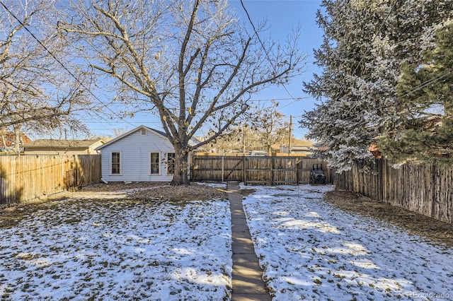 snowy yard with french doors